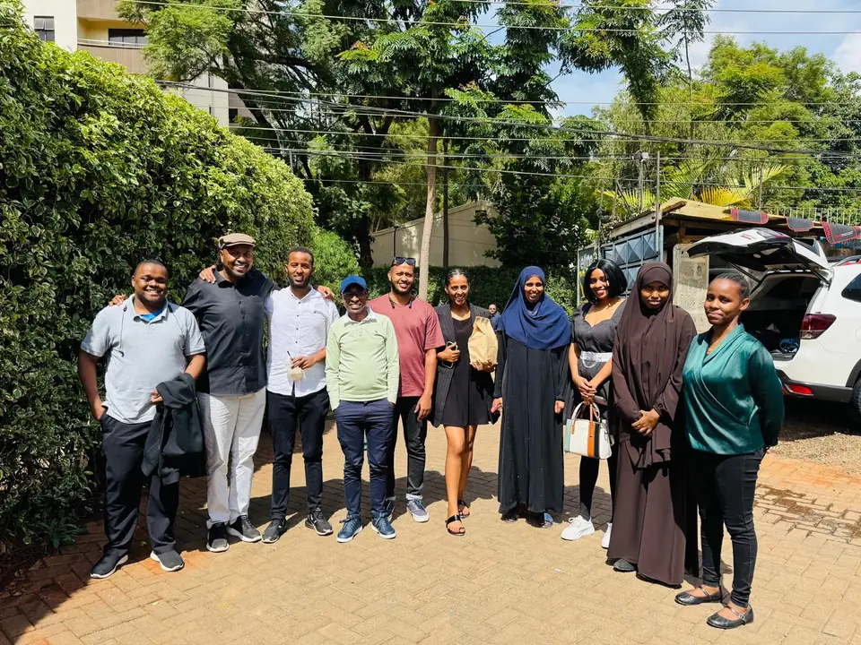 The RTI team together outside the office